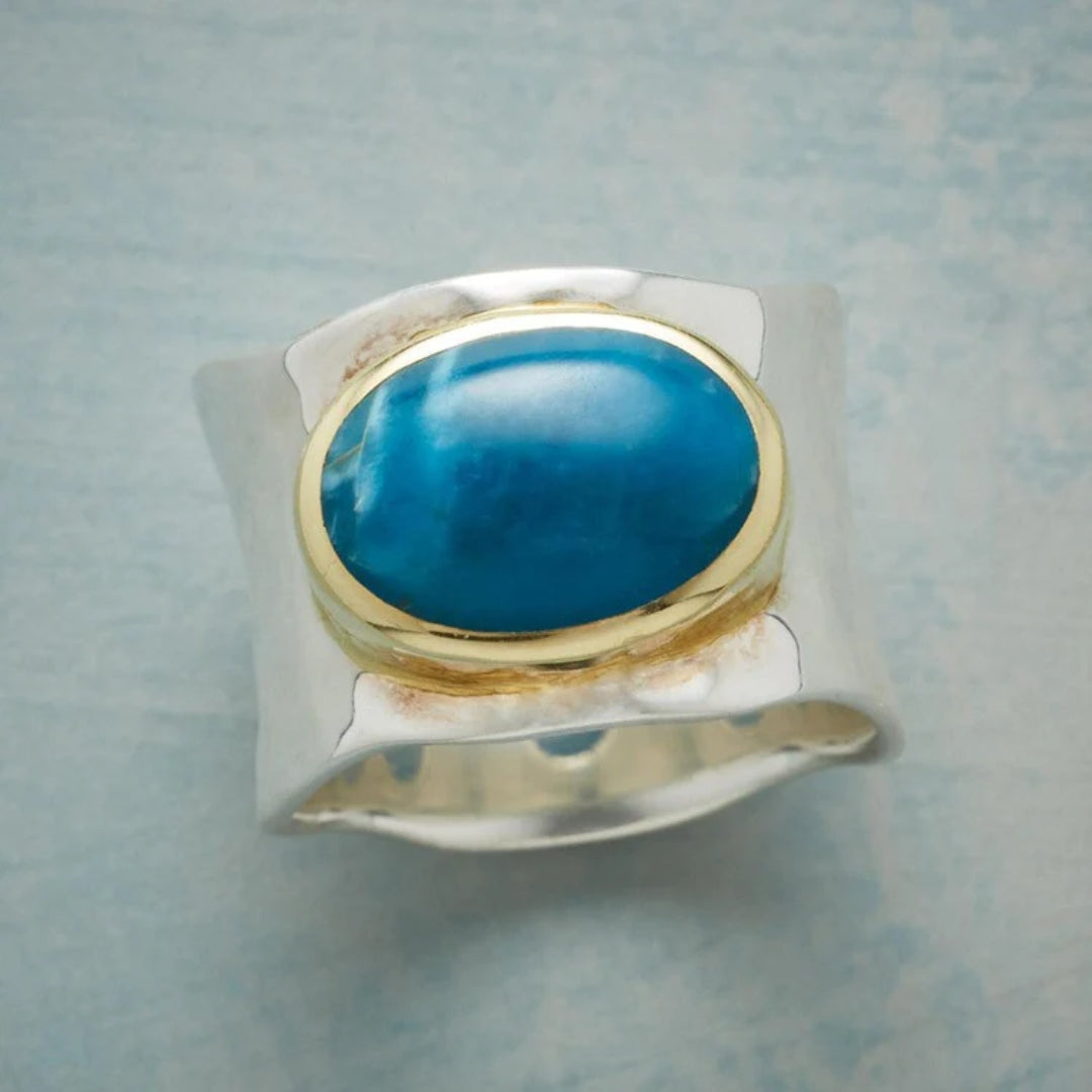 Bague vintage en argent avec pierre ovale bleue