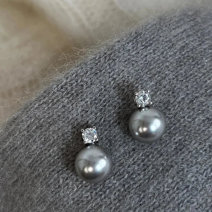 Boucles d'oreilles élégantes en perle noire et oxyde de zirconium