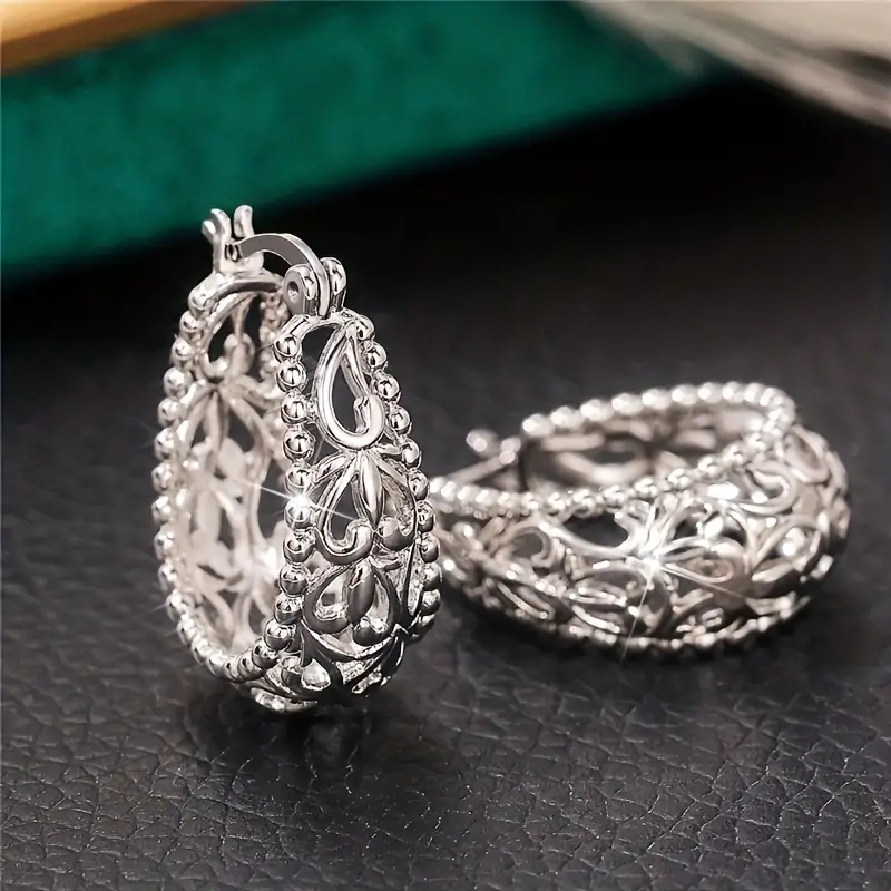 Boucles d'oreilles vintage en argent ajouré brillant