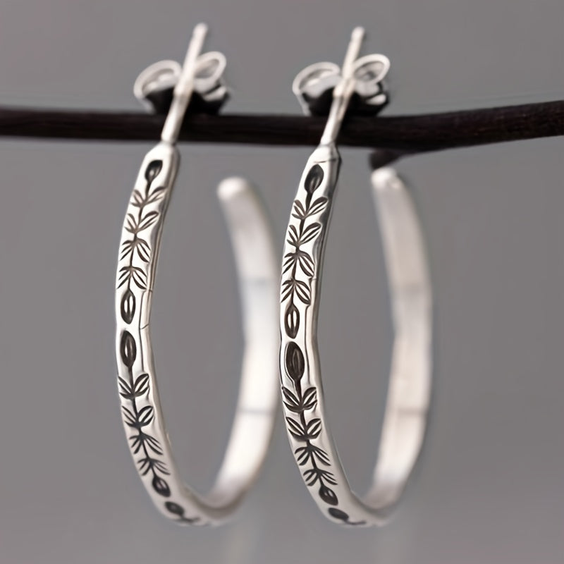 Boucles d'oreilles créoles en argent uniques