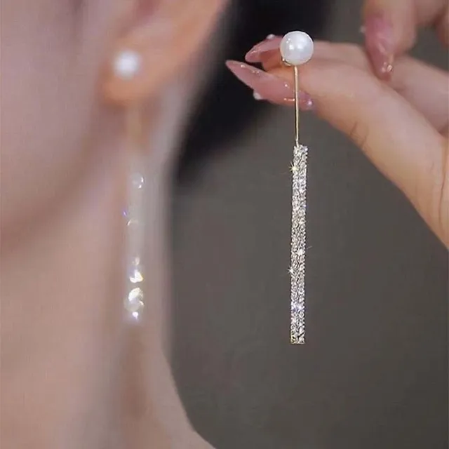 Élégantes boucles d'oreilles pendantes lumineuses avec perles