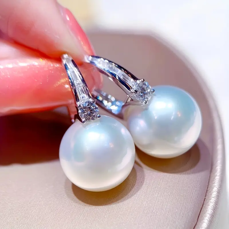 Élégantes boucles d'oreilles en perles en argent brillant